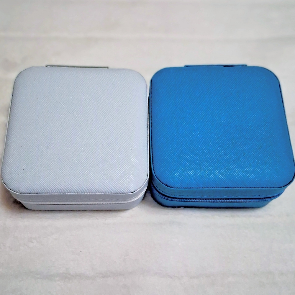 Two Travel Jewlwry Zip Around Boxes.